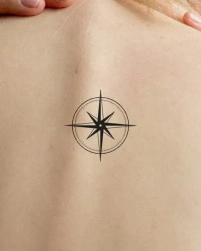 Compass rose tattoo on a back, preview