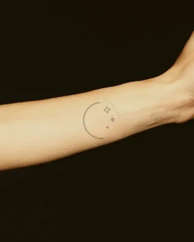 Crescent moon & stars tattoo on a forearm, preview