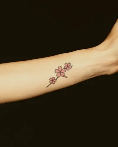 Cherry blossoms tattoo on a forearm, preview