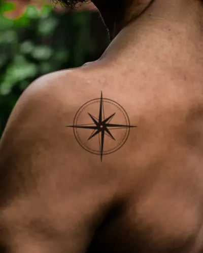 Compass rose tattoo on a shoulder, preview