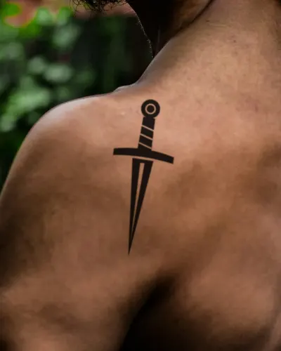 Dagger tattoo on a shoulder, preview