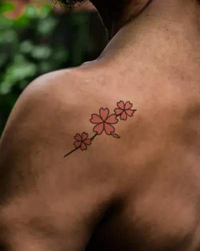 Cherry blossoms tattoo on a shoulder, preview