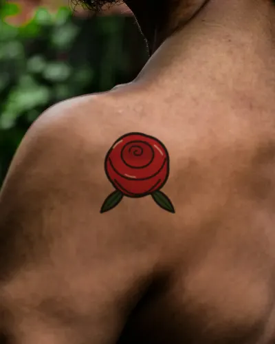 Traditional rose tattoo on a shoulder, preview