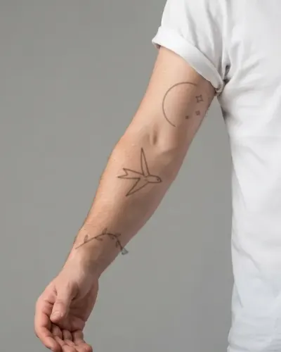 Fine line swallow tattoo on a sleeve, preview