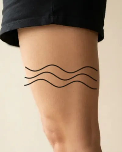 Ocean waves tattoo on a thigh, preview