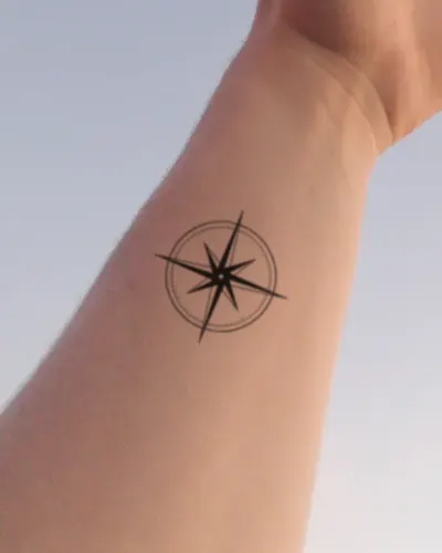 Compass rose tattoo on a wrist, preview