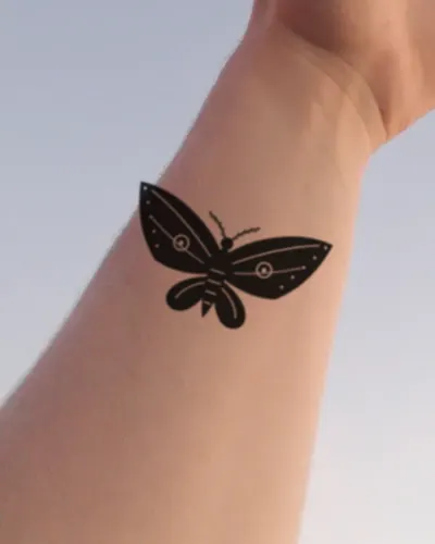 Moth tattoo on a wrist, preview