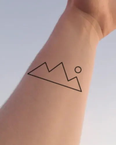 Mountain range tattoo on a wrist, preview