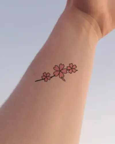 Cherry blossoms tattoo on a wrist, preview