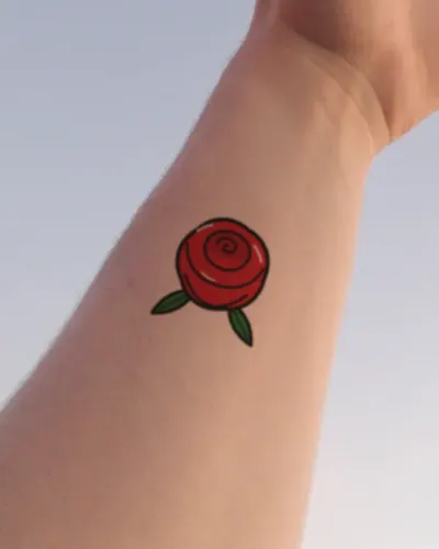Traditional rose tattoo on a wrist, preview