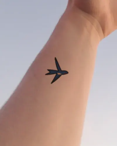 Traditional swallow tattoo on a wrist, preview